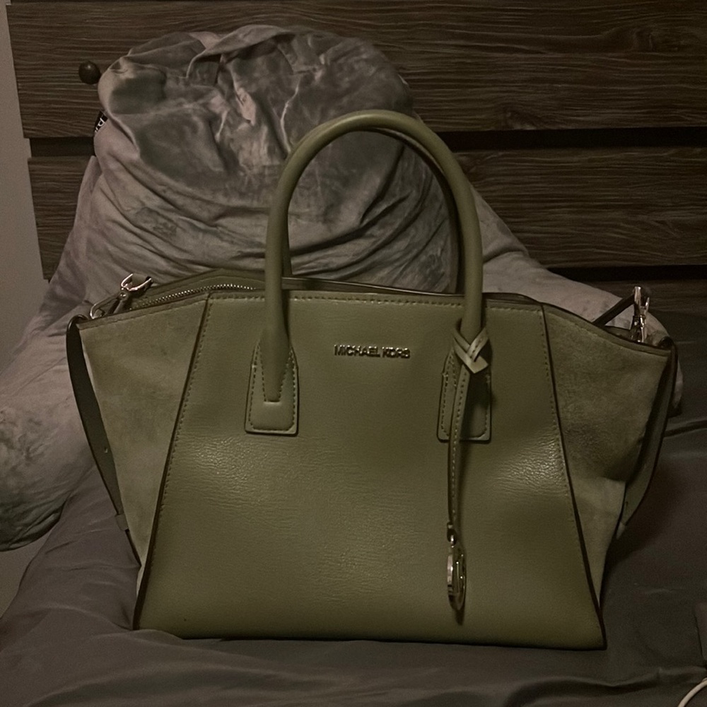 This is a Michael Kors bag that is in good condition.